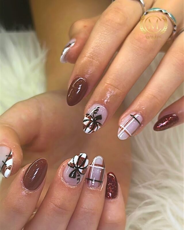 Brown and blush nail art with decorative details