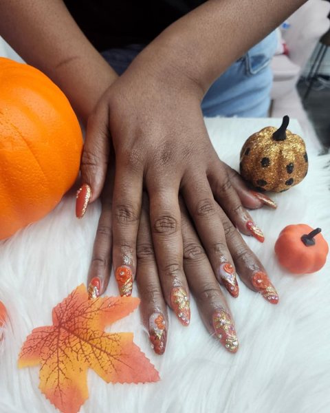 Orange and gold pumpkin spice nails done at ES Nail Spa
